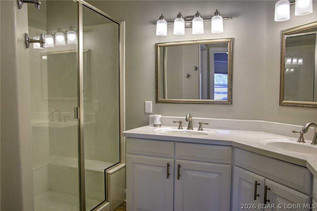 275 Flynn Road, Unit 106 Lake Ozark, MO 65049 - Photo 11 of 39 En suite bath with walk-in shower & double vanity.