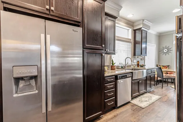 a kitchen with granite countertop lots of counter top space and stainless steel appliances