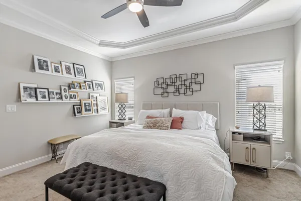 a bedroom with a bed and flat screen tv