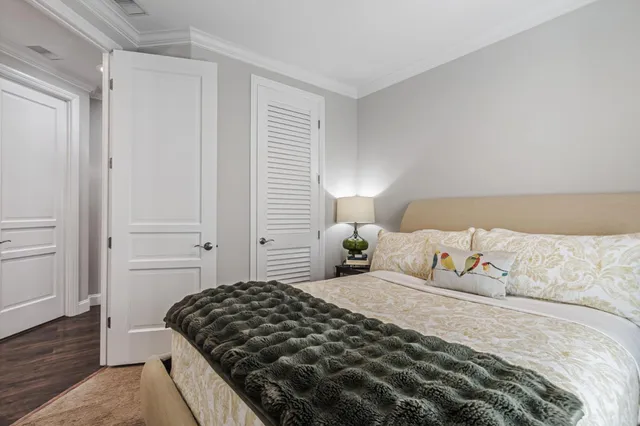 a bathroom with a granite countertop sink a mirror and shower