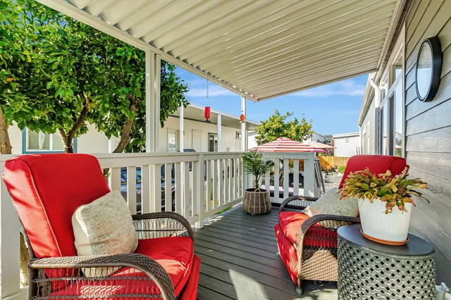 a view of a house with swimming pool and sitting area