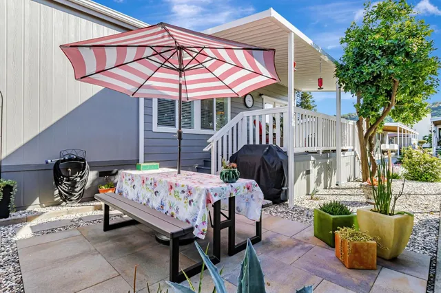 an aerial view of multiple houses with yard