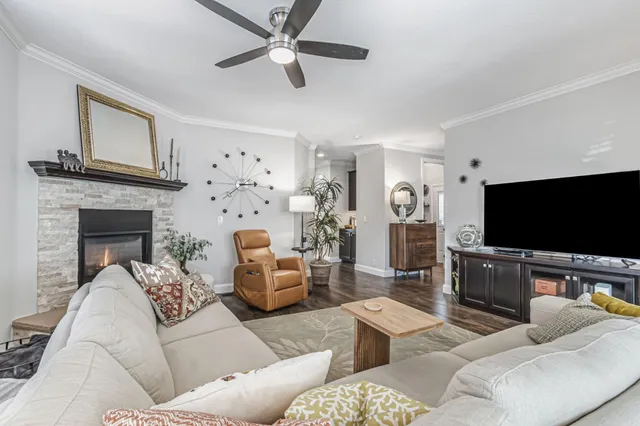 a kitchen with granite countertop lots of counter top space a sink stainless steel appliances and cabinets