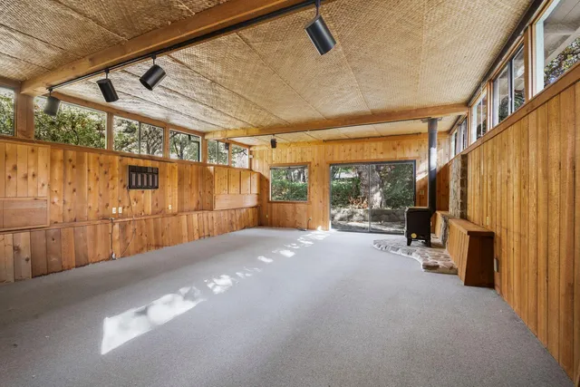 a view of a backyard with large trees