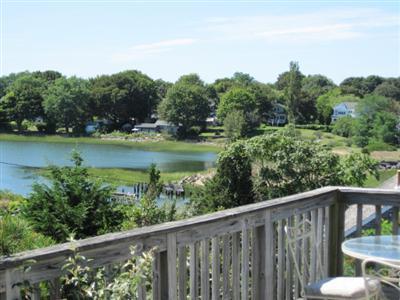 150 Pine Point Road Wellfleet, MA 02667 - Photo 7 of 11 a balcony with wooden floor and outdoor space