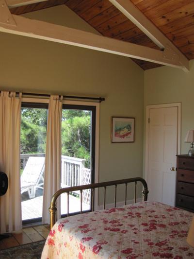 150 Pine Point Road Wellfleet, MA 02667 - Photo 8 of 11 a bedroom with a bed and wooden floor