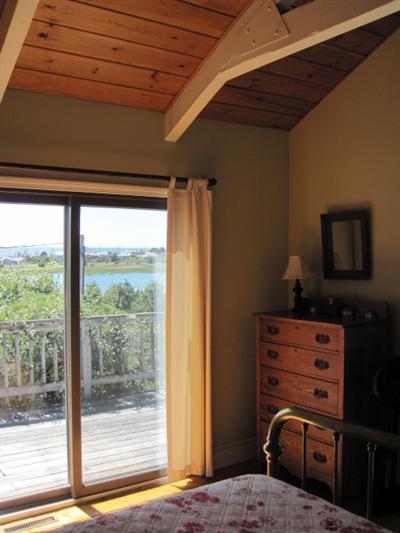 150 Pine Point Road Wellfleet, MA 02667 - Photo 9 of 11 a bedroom with a bed and a television