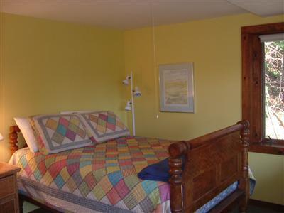 150 Pine Point Road Wellfleet, MA 02667 - Photo 10 of 11 a bed sitting in a bedroom next to a window