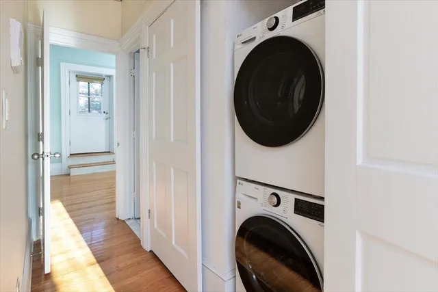 a view of a hallway with washer and dryer