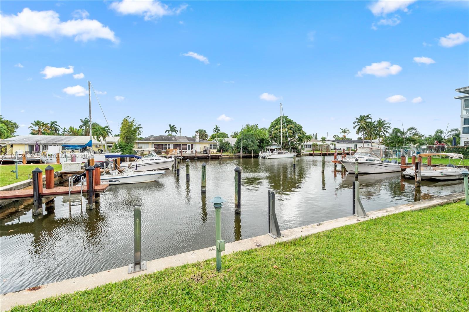 900 Southwest 12th Street, Unit 206 Fort Lauderdale, FL 33315 - Photo 1 of 24 a lake view with a bench and lake view