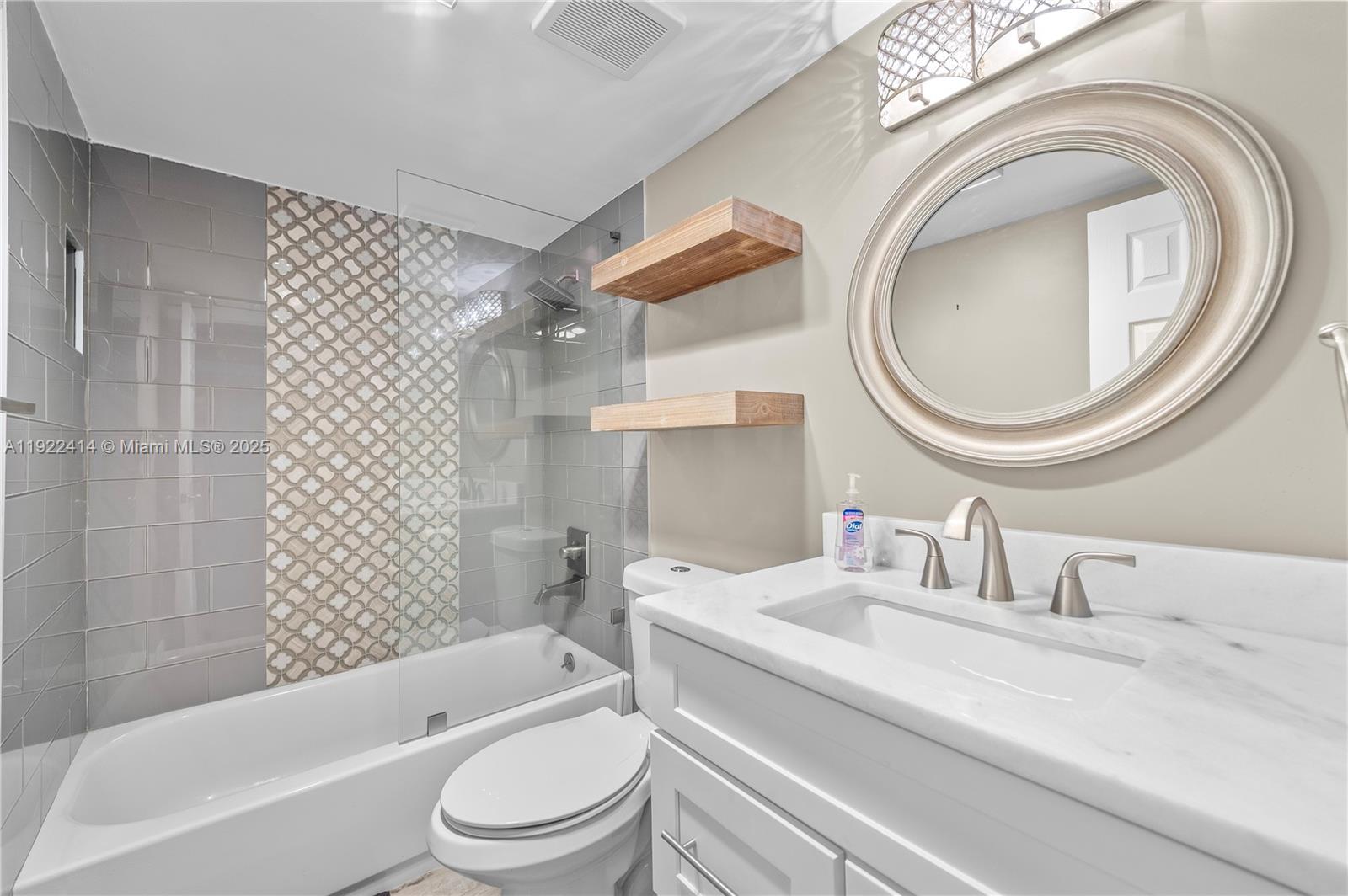 900 Southwest 12th Street, Unit 206 Fort Lauderdale, FL 33315 - Photo 15 of 24 a bathroom with a sink a toilet and shower