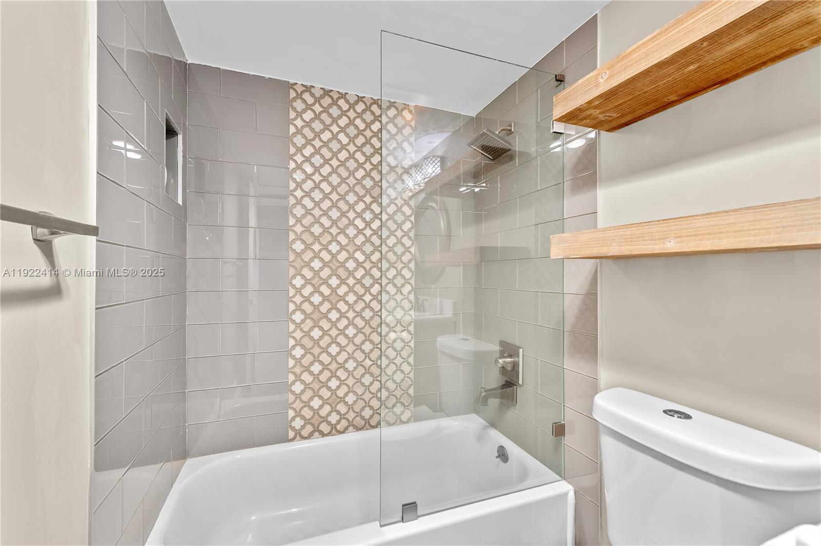 900 Southwest 12th Street, Unit 206 Fort Lauderdale, FL 33315 - Photo 17 of 24 a bathroom with a toilet and shower