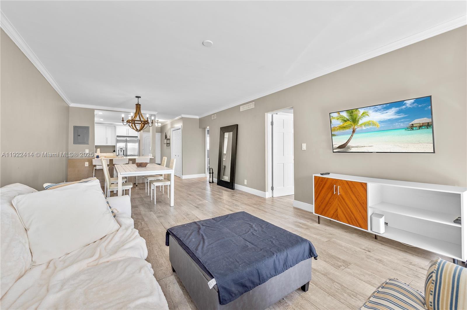 900 Southwest 12th Street, Unit 206 Fort Lauderdale, FL 33315 - Photo 18 of 24 a living room with furniture and a flat screen tv