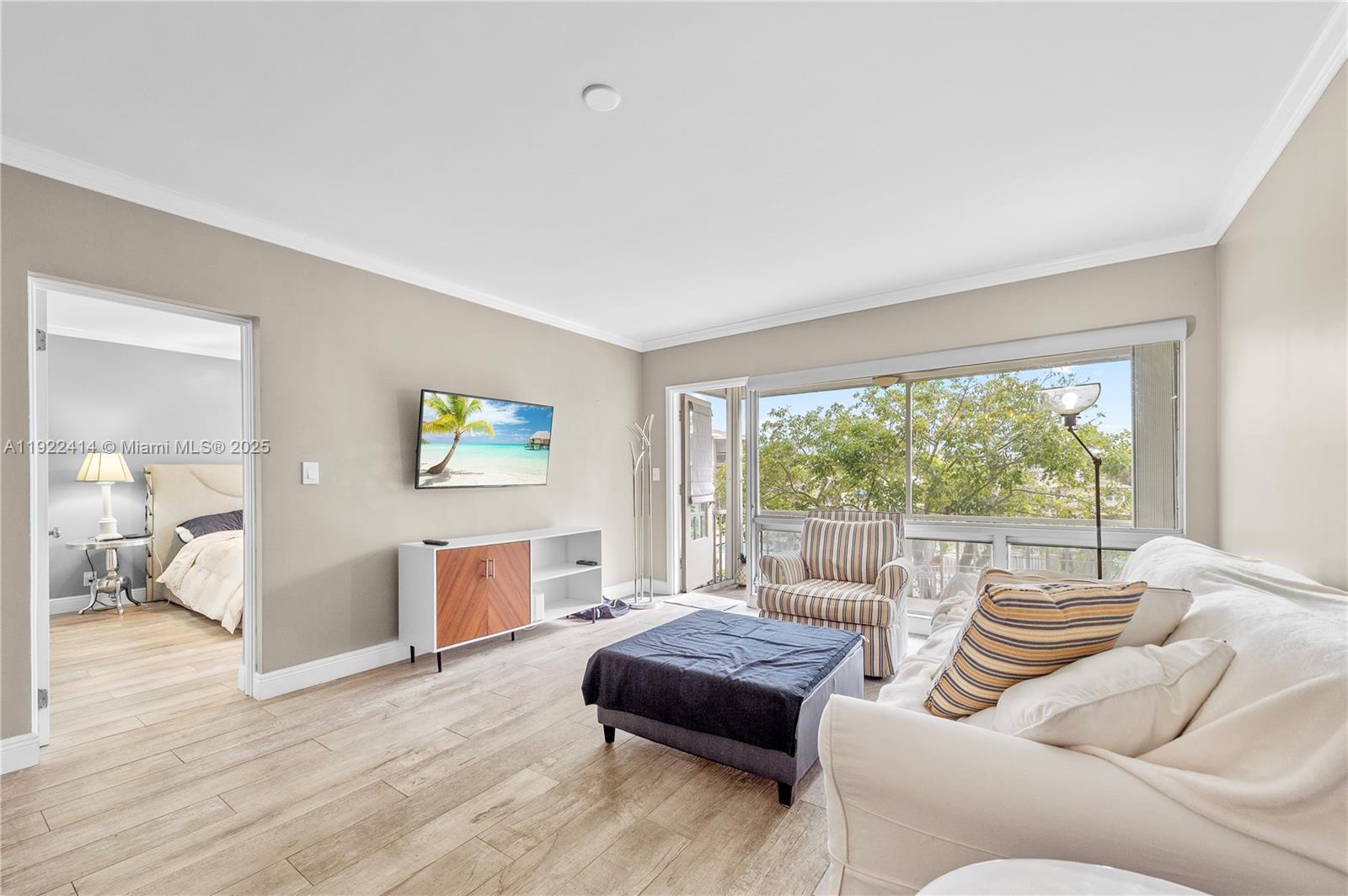 900 Southwest 12th Street, Unit 206 Fort Lauderdale, FL 33315 - Photo 20 of 24 a living room with furniture and a large window
