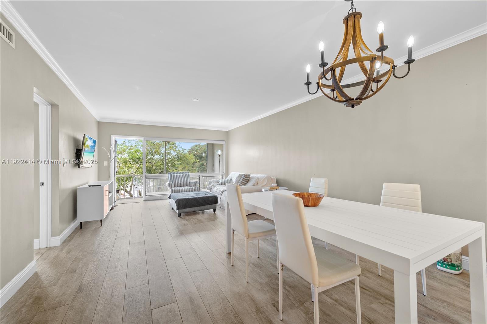 900 Southwest 12th Street, Unit 206 Fort Lauderdale, FL 33315 - Photo 7 of 24 a view of a dining room with furniture window and outside view
