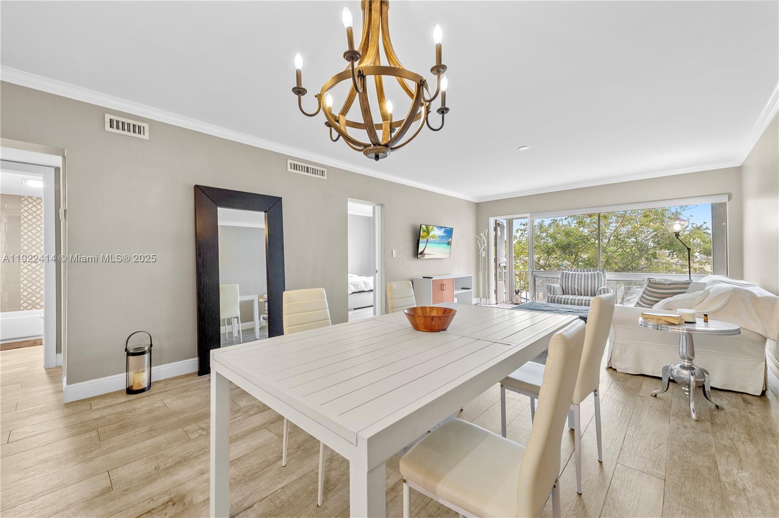 900 Southwest 12th Street, Unit 206 Fort Lauderdale, FL 33315 - Photo 8 of 24 a view of a dining room with furniture window and outside view