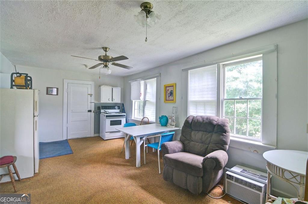 2165 Townsend Mill Road Young Harris, GA 30582 - Photo 4 of 12 a living room with furniture and a window
