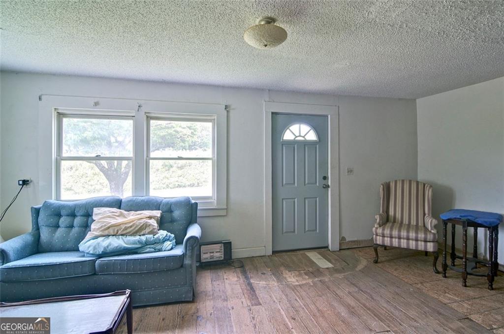2165 Townsend Mill Road Young Harris, GA 30582 - Photo 8 of 12 a living room with furniture and a window