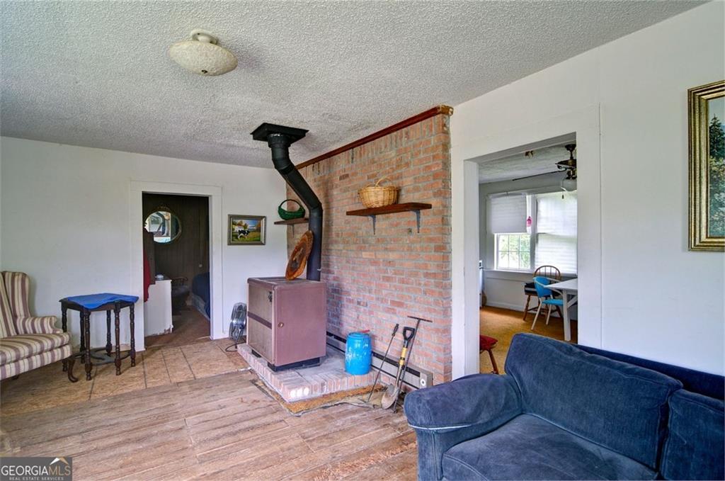 2165 Townsend Mill Road Young Harris, GA 30582 - Photo 9 of 12 a living room with furniture and wooden floor