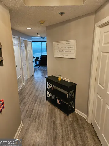 a room with wooden floors and couch