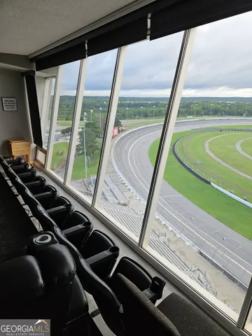 a view of a balcony with chairs