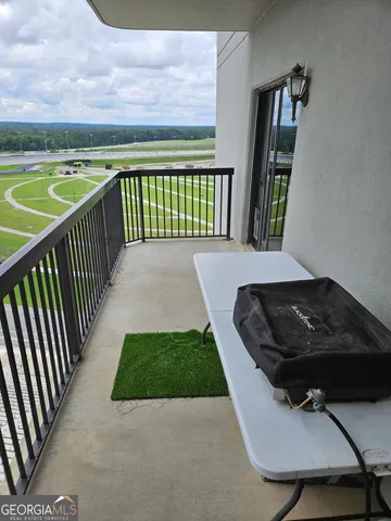 a view of a balcony with wooden floor