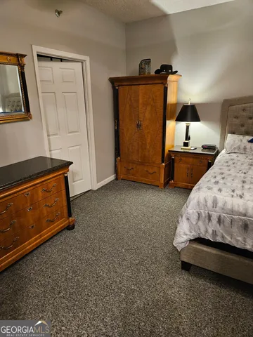 a bedroom with bed and window