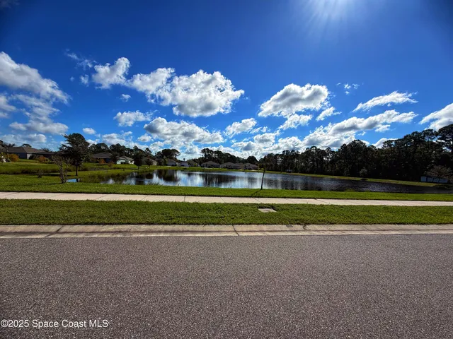 a view of a golf course with a lake