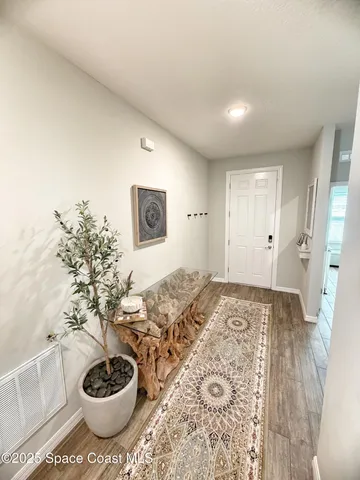 a spacious bathroom with a sink and a mirror