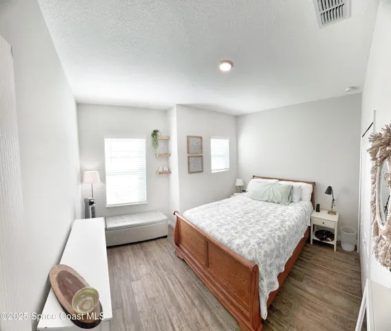 a room with a bed and a table in it