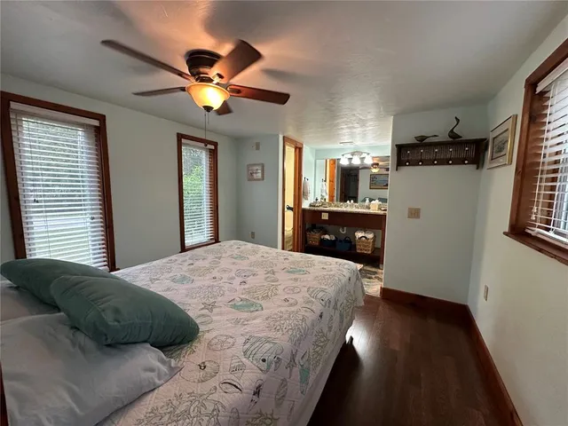 a bathroom with a toilet and a shower curtain