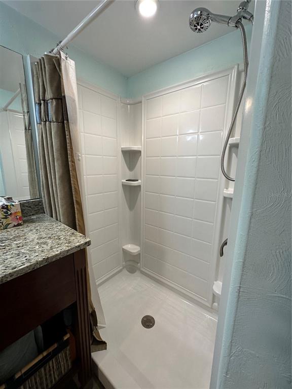 56315 Hickory Road Astor, FL 32102 - Photo 22 of 31 a bathroom with a sink a toilet and shower