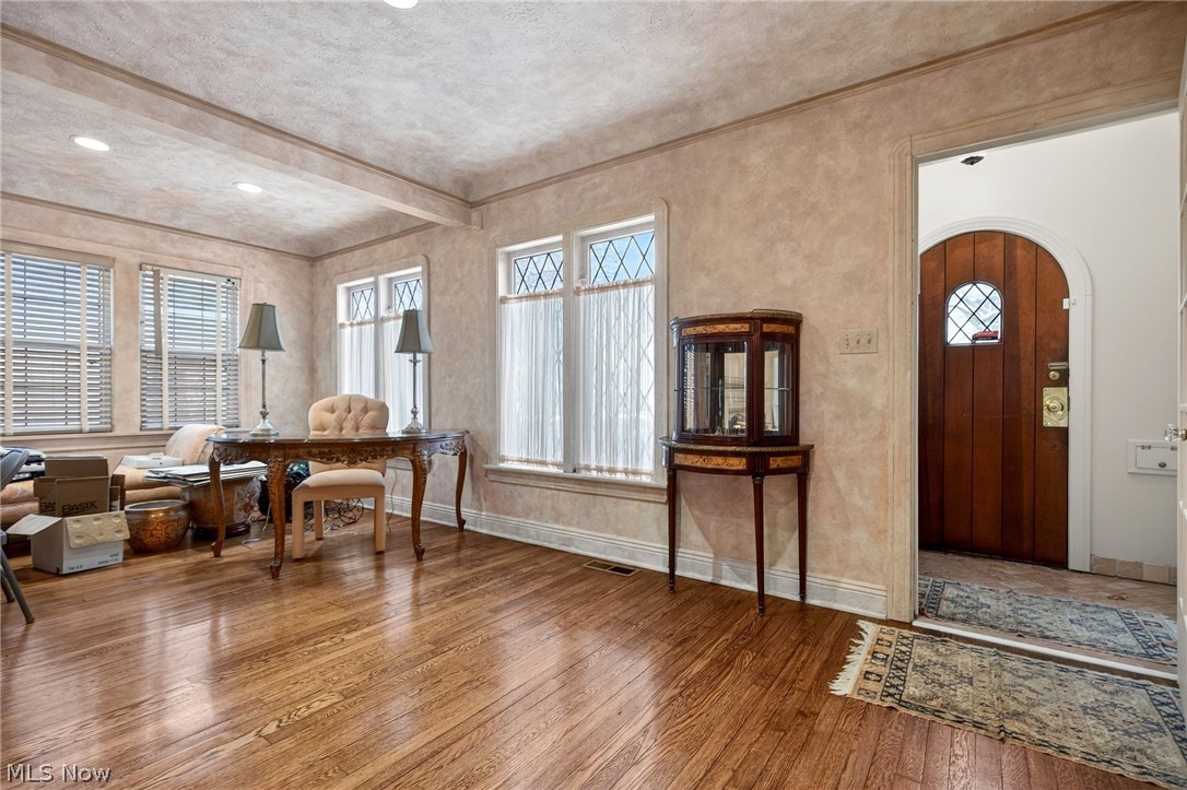 3498 Bainbridge Road Cleveland Heights, OH 44118 - Photo 7 of 50 Foyer featuring hardwood / wood-style floors, beamed ceiling, and arched walkways