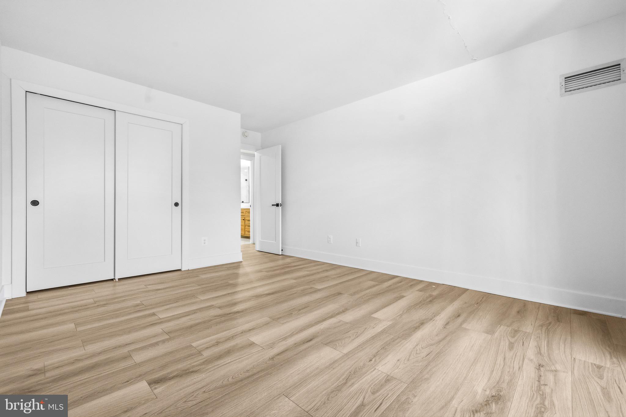 6101 Edsall Road, Unit 602 Alexandria, VA 22304 - Photo 23 of 38 a view of an empty room with wooden floor