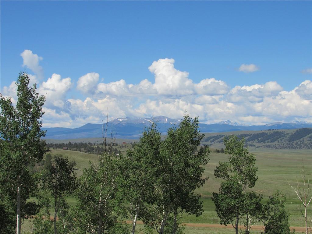 12950 Elkhorn Road Como, CO 80432 - Photo 1 of 30 a view of a lake in middle of forest