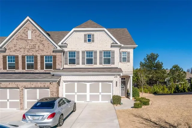 a front view of a house with a yard