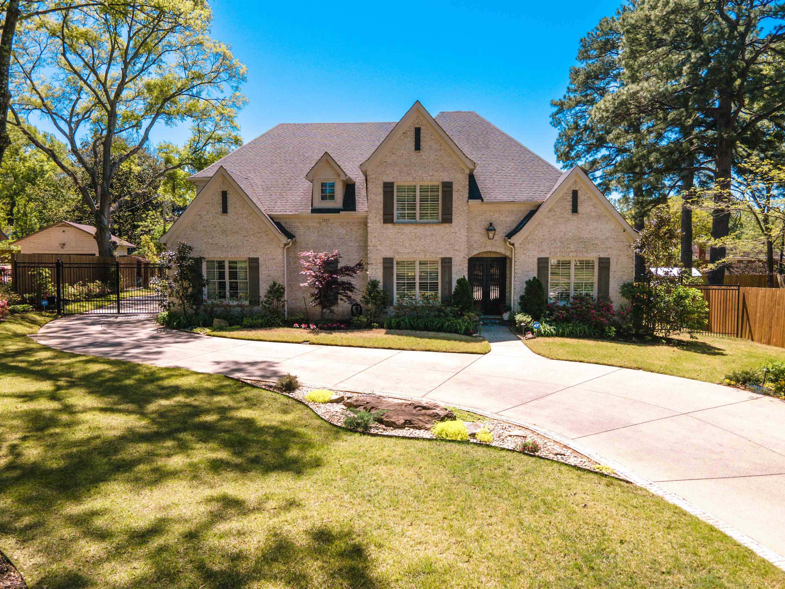 5293 Cole Road Memphis, TN 38120 - Photo 1 of 40 a front view of a house with a yard