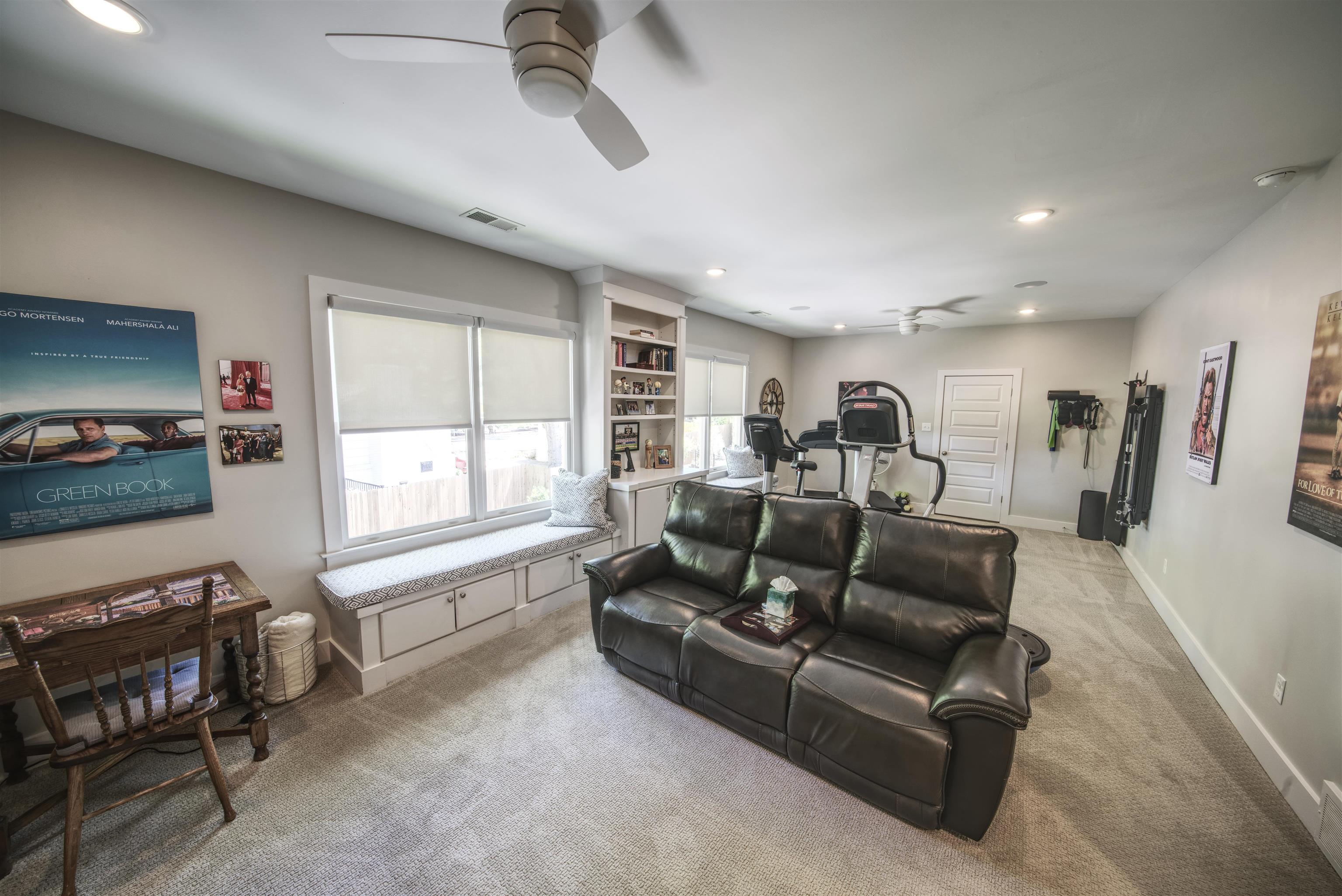 5293 Cole Road Memphis, TN 38120 - Photo 28 of 40 a living room with furniture a window and a flat screen tv