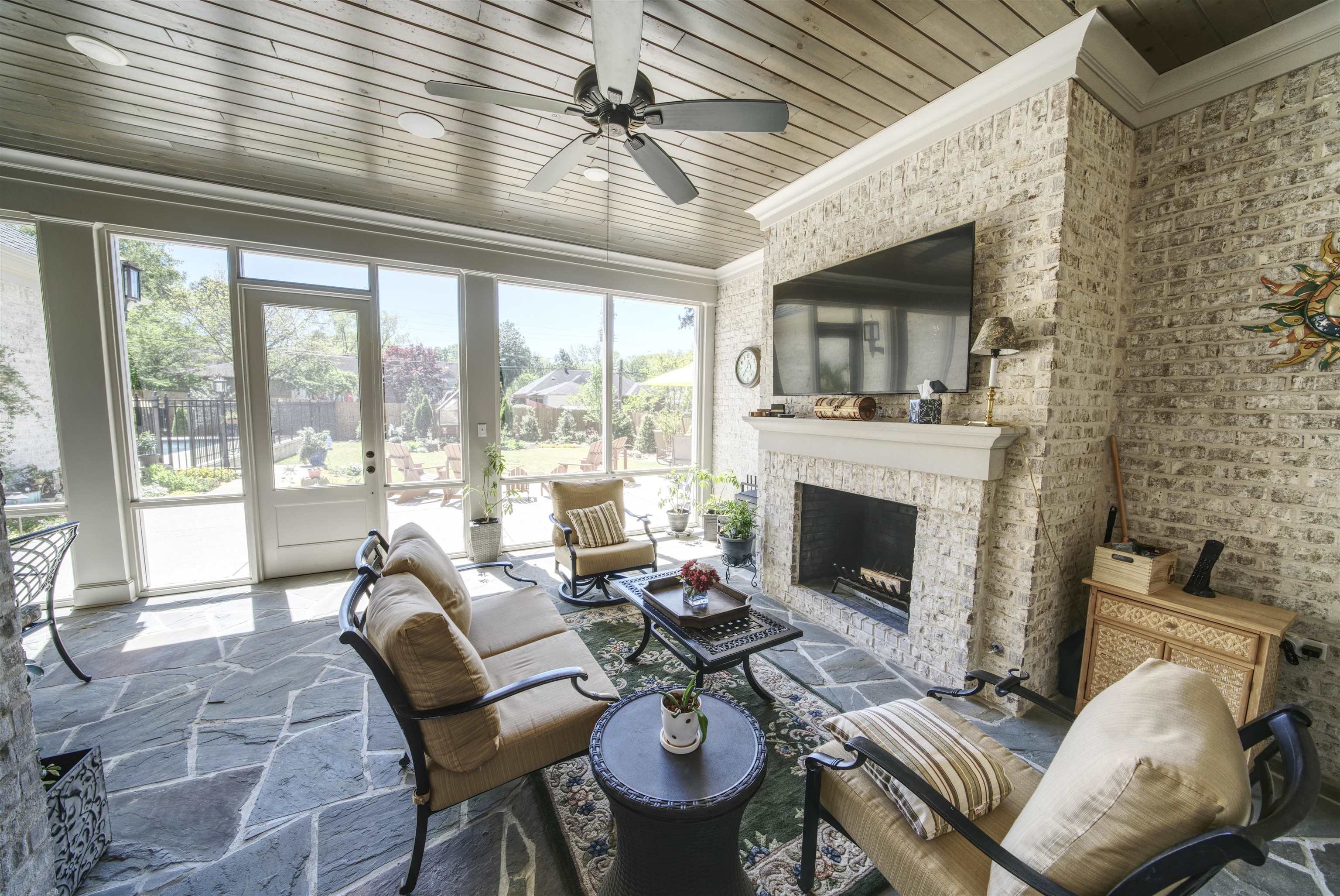 5293 Cole Road Memphis, TN 38120 - Photo 31 of 40 a living room with furniture a fireplace and a dining table