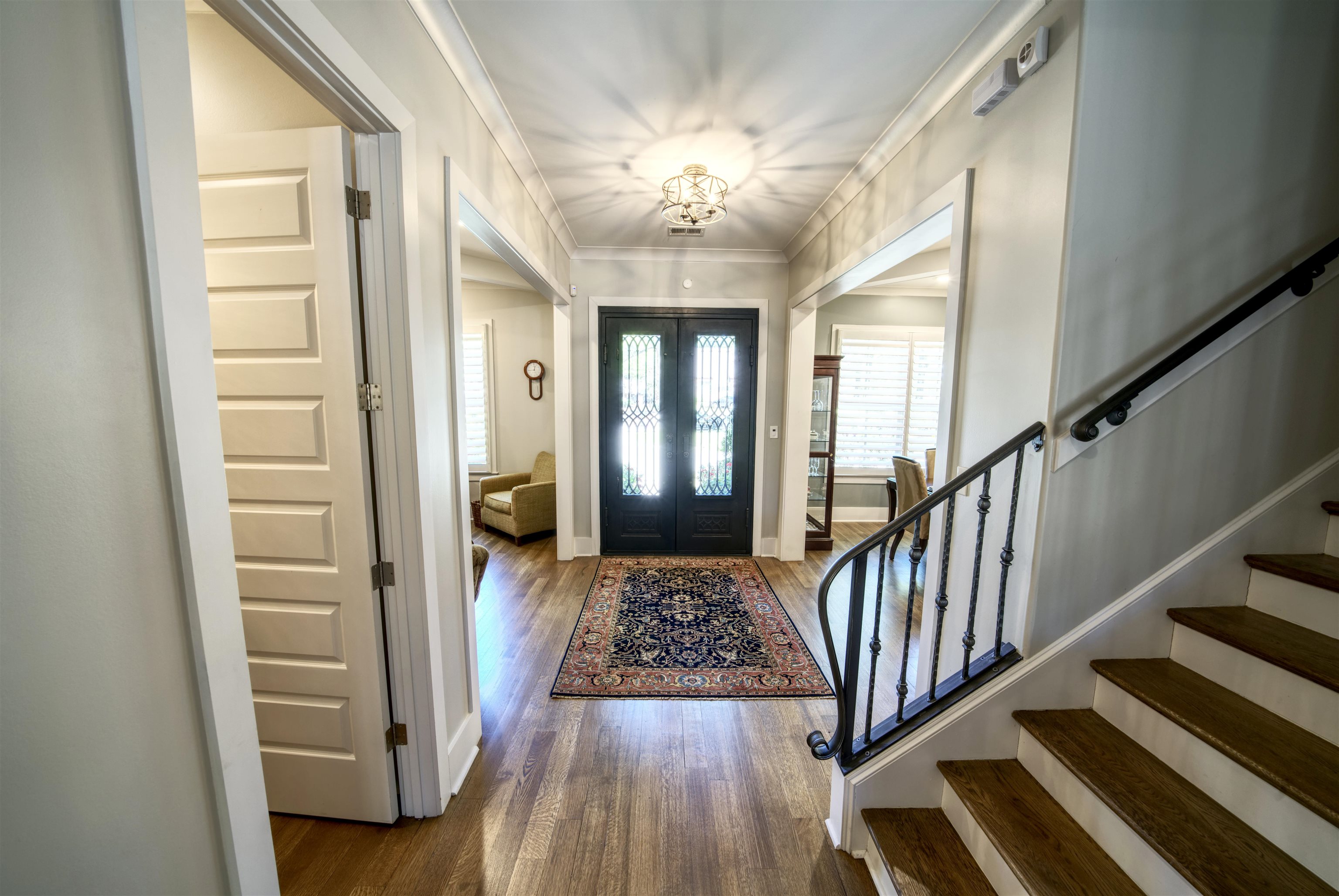 5293 Cole Road Memphis, TN 38120 - Photo 7 of 40 a view of a hallway view with wooden floor and staircase