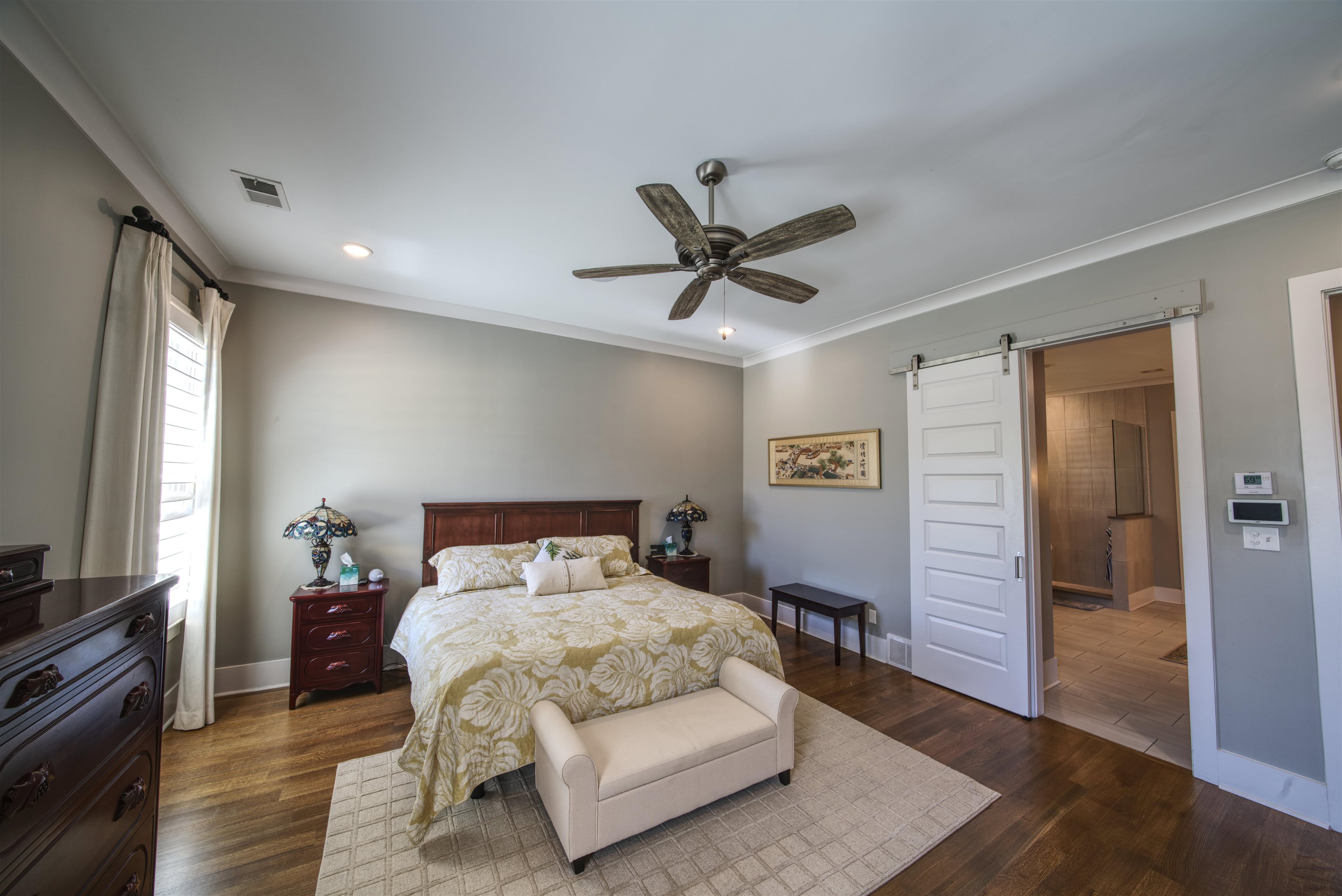 5293 Cole Road Memphis, TN 38120 - Photo 9 of 40 a bed room with a bed and a television