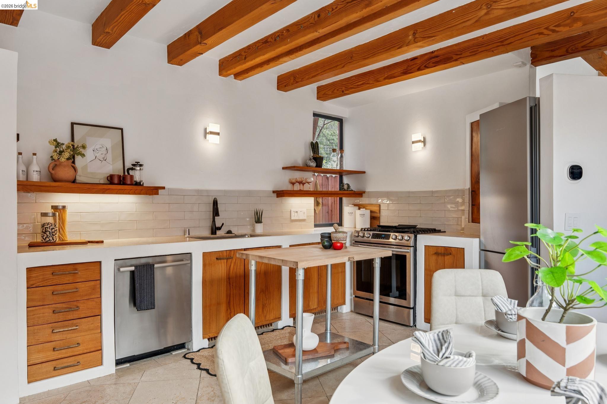 2015 Delaware Street Berkeley, CA 94709 - Photo 14 of 60 Kitchen with wood finish cabinets, stainless steel appliances, open shelves, beam ceiling, and light tile patterned floors