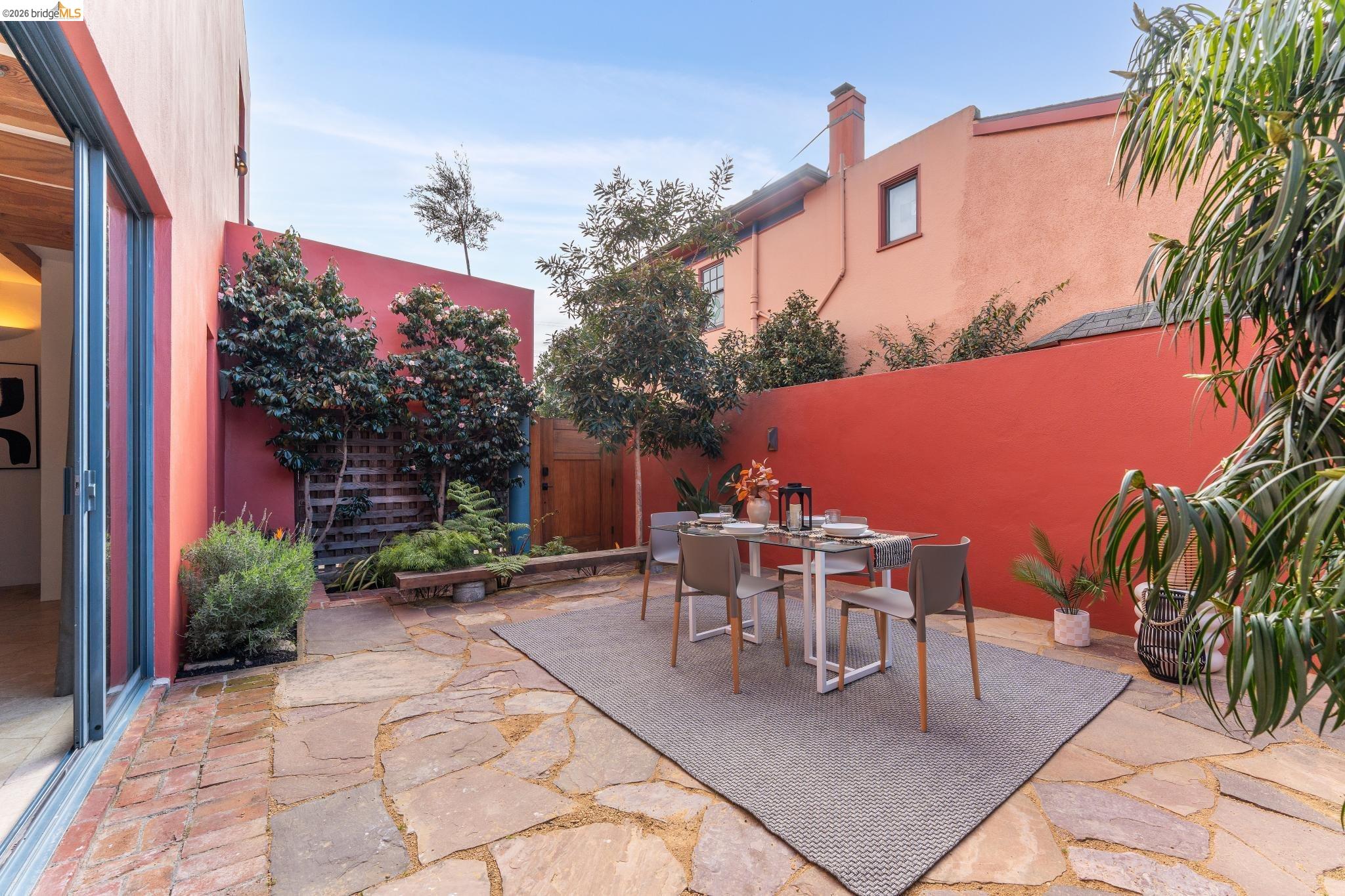 2015 Delaware Street Berkeley, CA 94709 - Photo 19 of 60 Fenced backyard with a patio and outdoor dining area