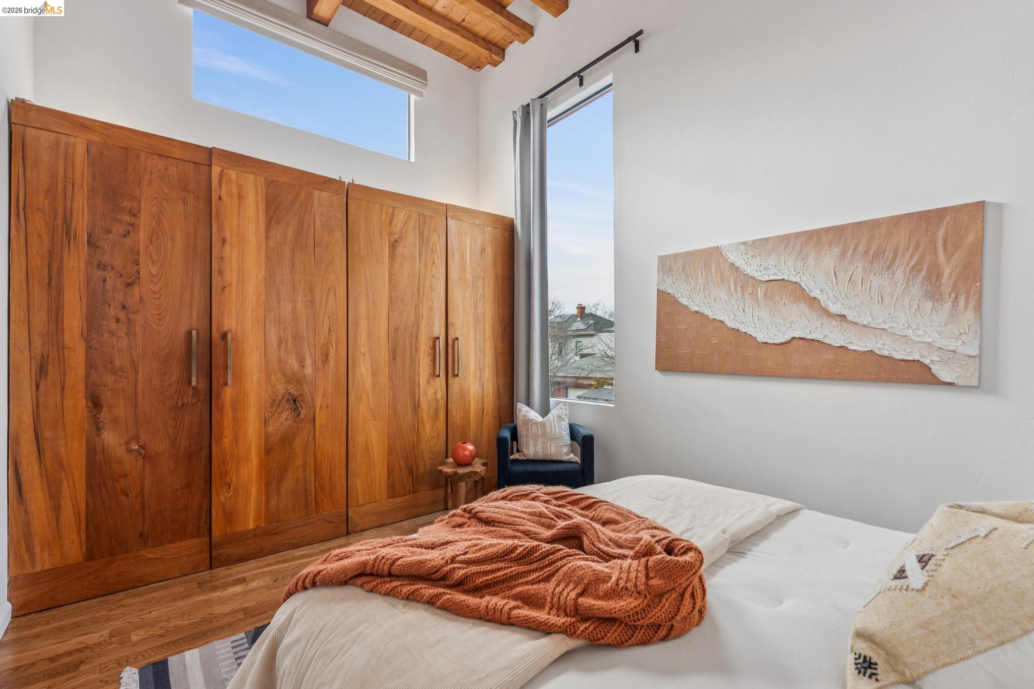 2015 Delaware Street Berkeley, CA 94709 - Photo 40 of 60 Bedroom with multiple windows, wood finished floors, wooden ceiling, and vaulted ceiling with beams