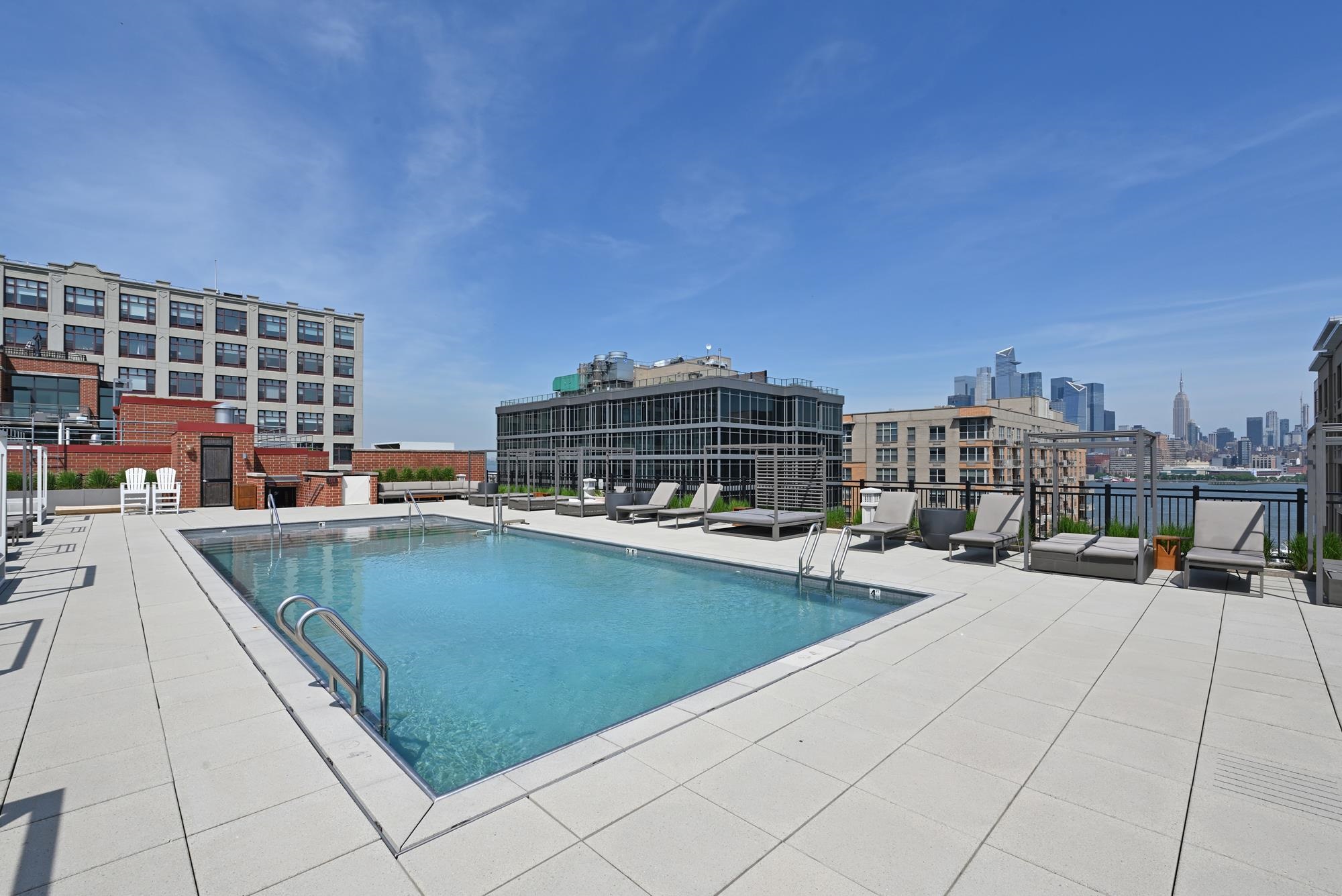 1450 Washington Street, Unit 609 Hoboken, NJ 07030 - Photo 12 of 30 a view of outdoor space with swimming pool and seating