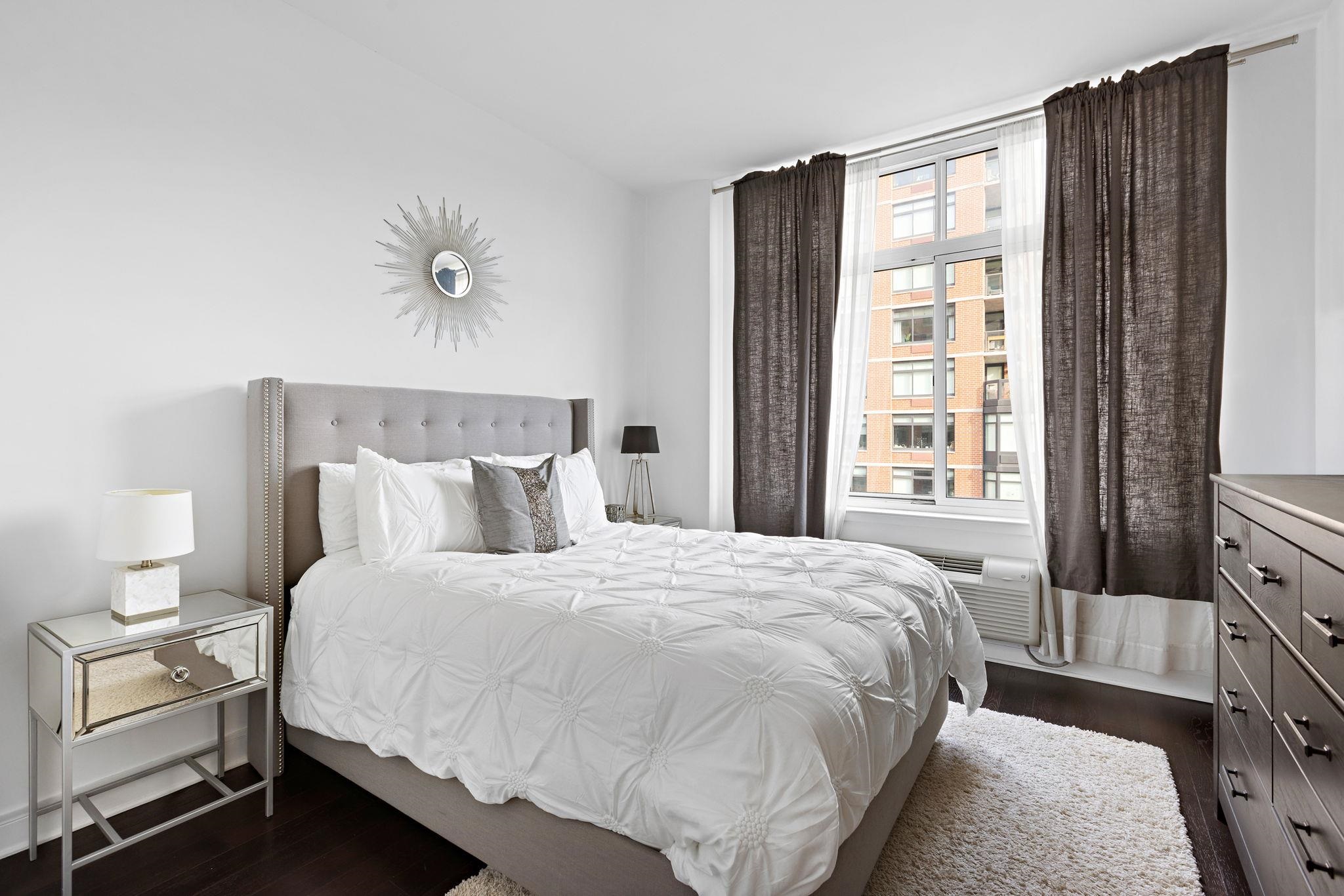 1450 Washington Street, Unit 609 Hoboken, NJ 07030 - Photo 7 of 30 a bedroom with a bed and lamps