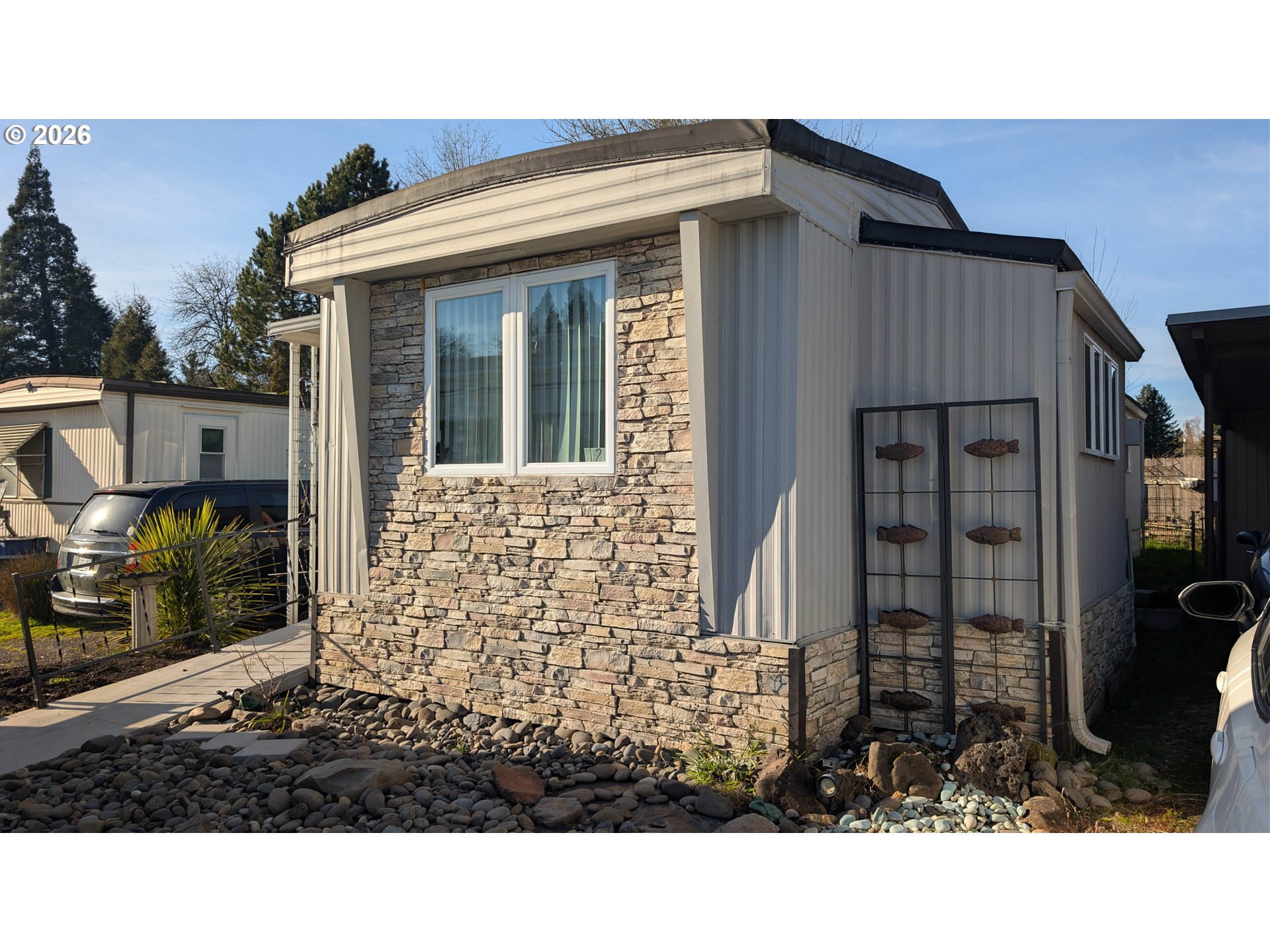 a view of house with a door and balcony