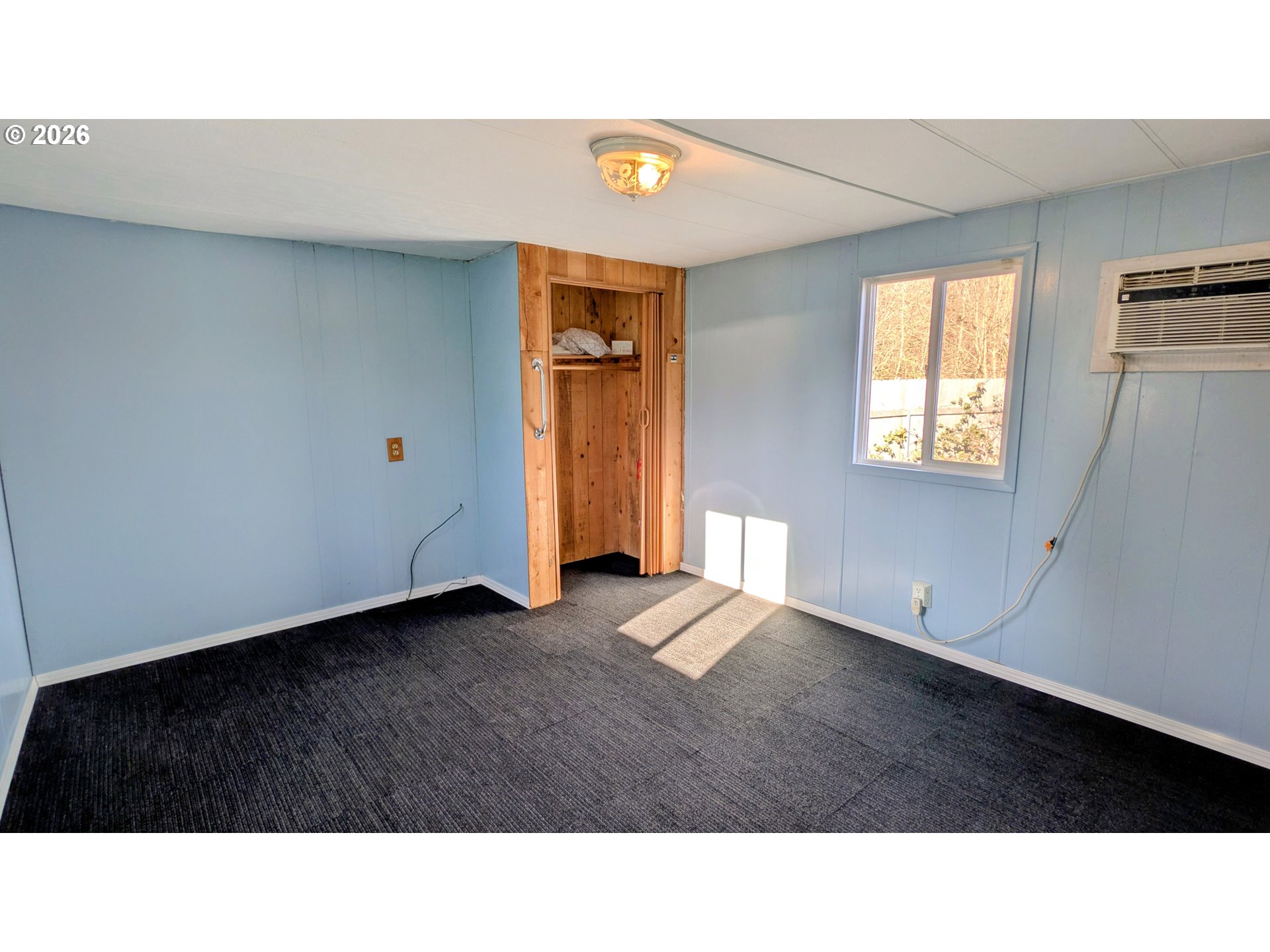 3203 Southeast Vineyard Road, Unit 12 Milwaukie, OR 97267 - Photo 12 of 20 a black and white photo of a living room