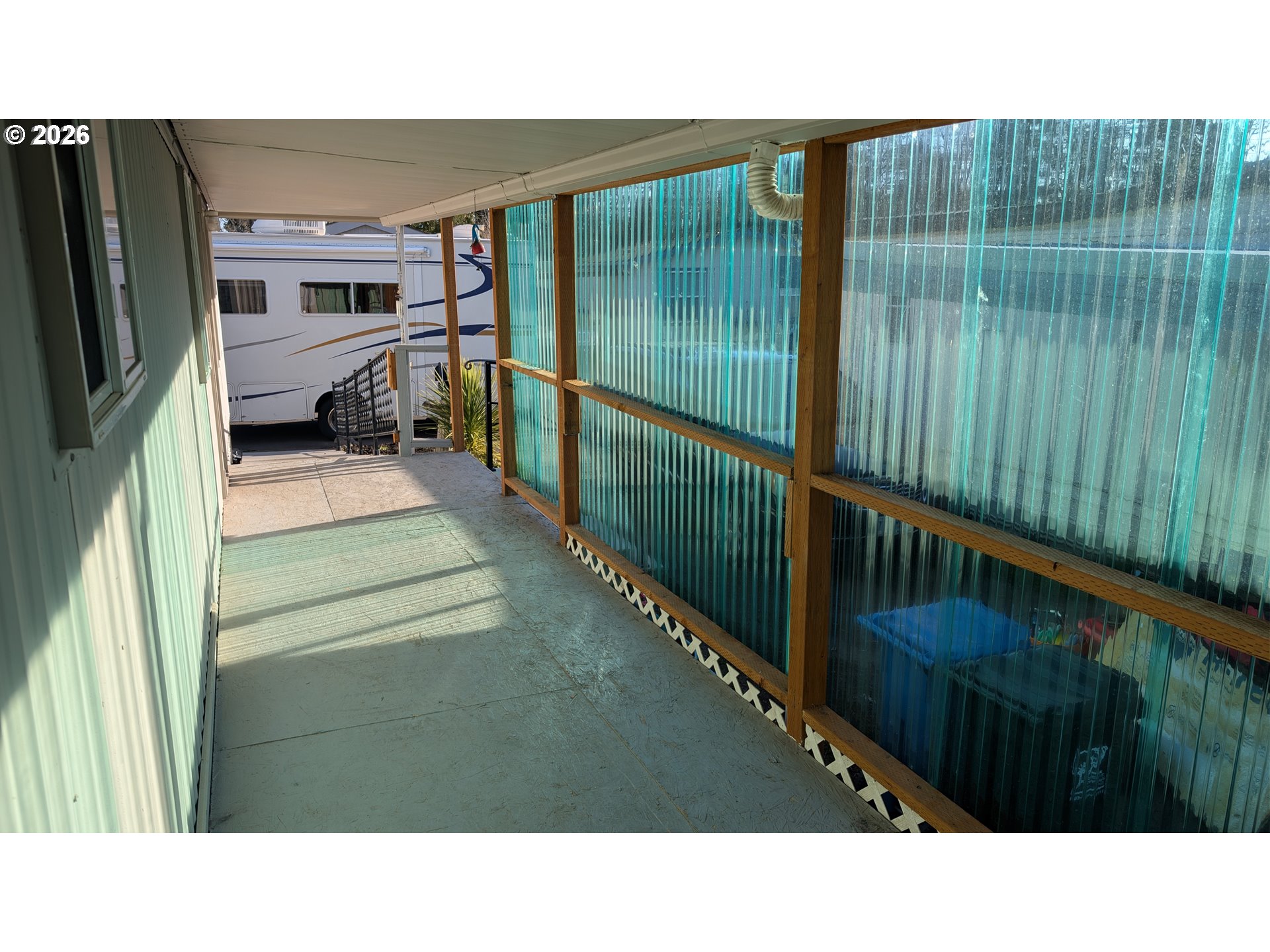 3203 Southeast Vineyard Road, Unit 12 Milwaukie, OR 97267 - Photo 5 of 20 a black and white photo of a balcony