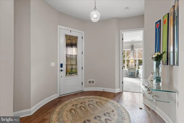 a kitchen with granite countertop a refrigerator a stove a sink and a refrigerator